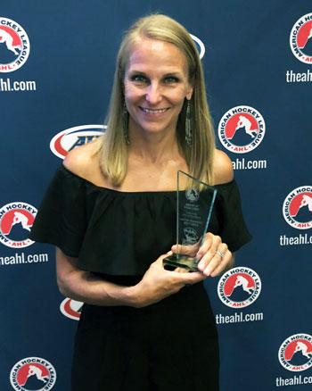 Tera Black accepts the AHL's Community Service award